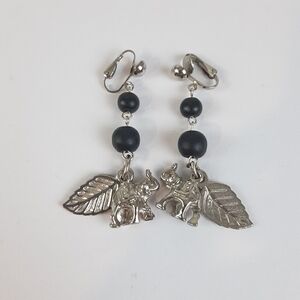 🔥Silver-tone dangle earrings with a leaf and elephant charm with black beads